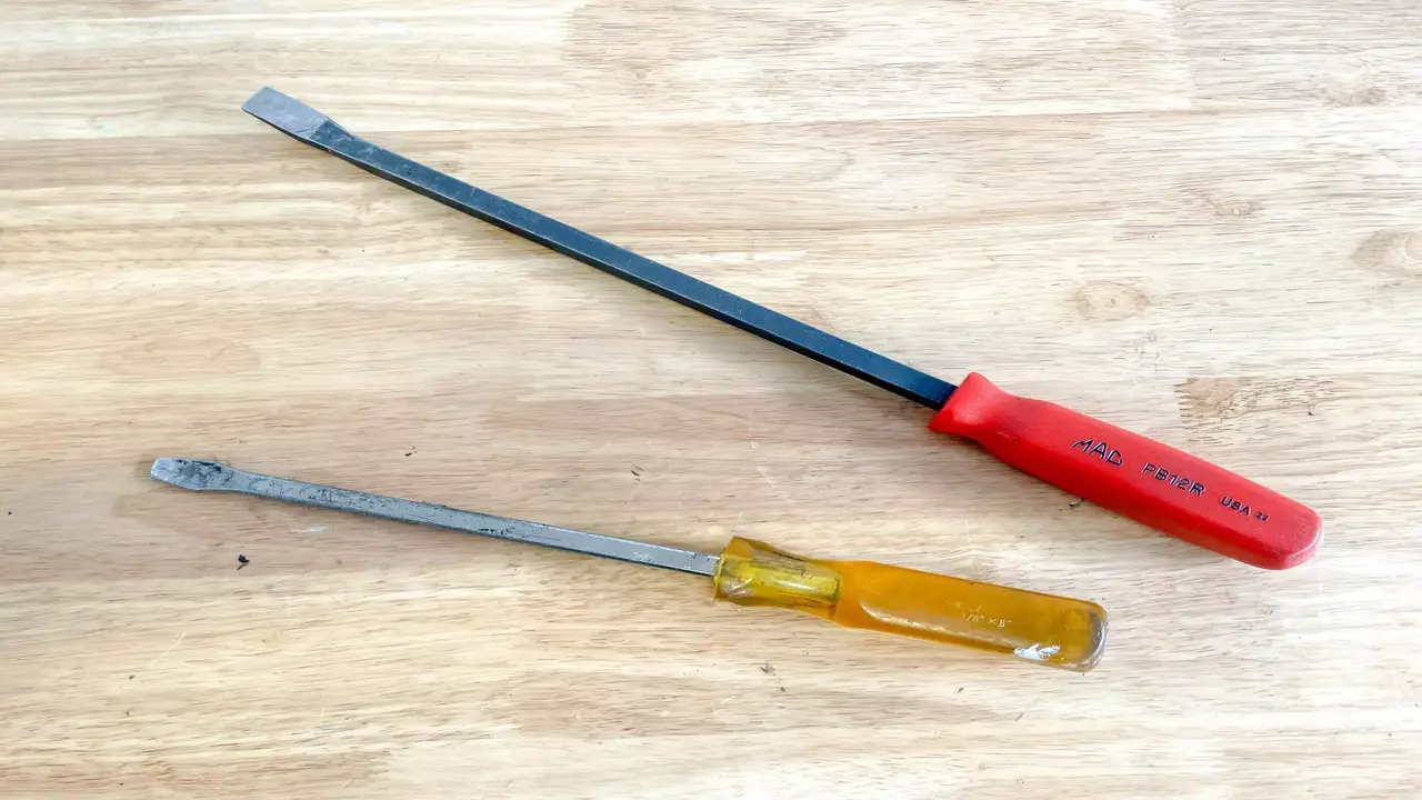 Using A Screwdriver Or Pry Bar