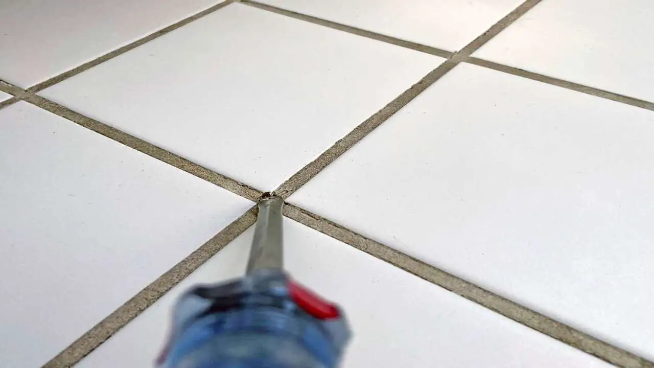 Start By Removing The Grout Between The Tiles